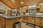 Beautifully appointed kitchen with custom cabinets